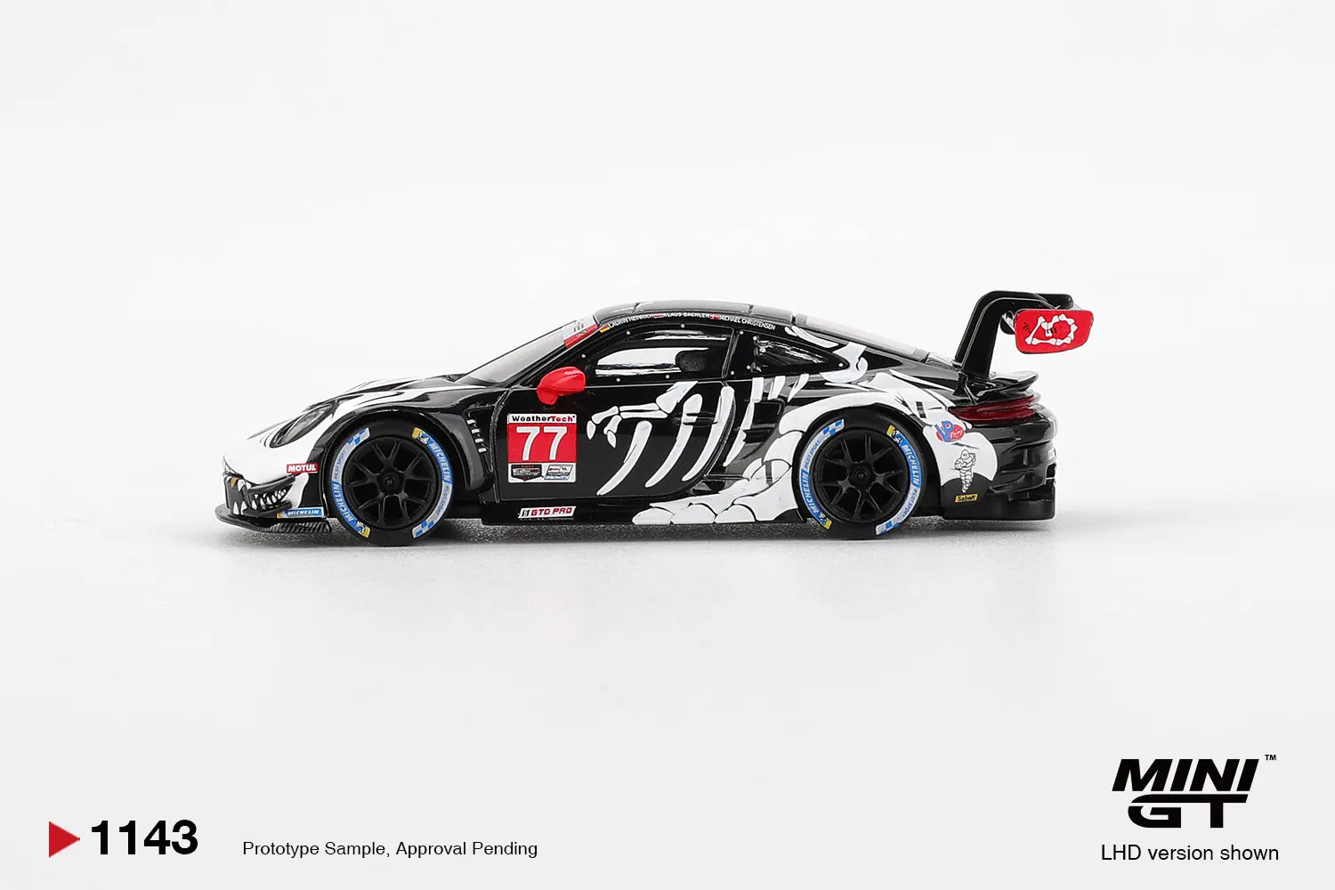 Mini GT Porsche 911 GT3 R #77 AO Racing Skeleton Rexy 2025 IMSA #1143 1:64